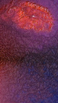 Mixing bright colors with alcohol ink in a creative art process