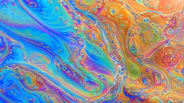 Vibrant abstract fluid art with swirling blue, orange and turquoise colors, glossy bubbles and marbled liquid texture, ideal for bold backgrounds, banners and modern creative designs.