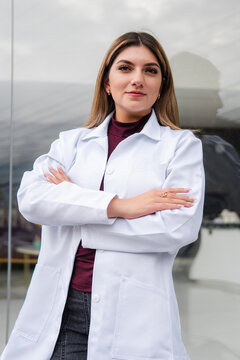 Confident female doctor posing with arms crossed