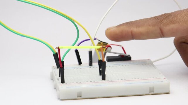 led filament bulb activated by limit switch press on a breadboard demo setup