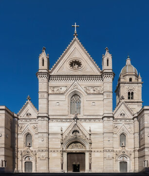 Naples Cathedral (Duomo di Napoli) in Italy, featuring the neo-Gothic facade of Santa Maria Assunta, intricate stone details, ornate portals, bell tower, and historic religious architecture