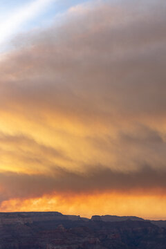 smoke over grand canyon at sunset vertical