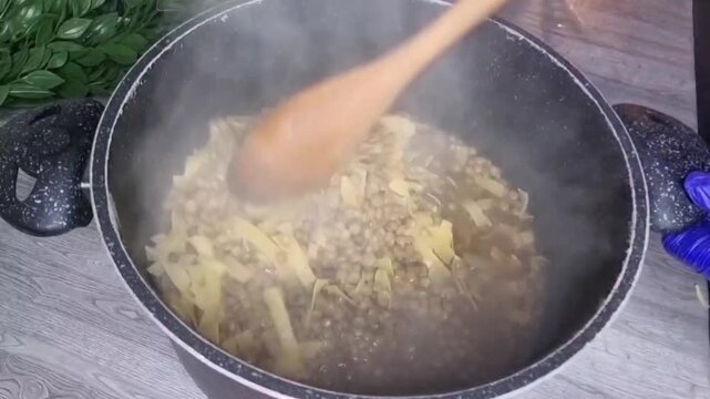 Adding pasta to traditional syrian haraq osbao dish with lentils