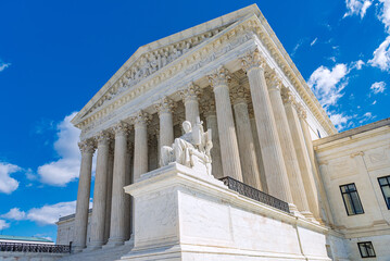 Fototapeta premium Wide low angle view shows Authority of Law outside the US Supreme Court.