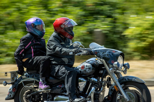 Milton Keynes,UK - July 25th 2026: Man and pillion passenger riding a 2006 Yamaha xvs driving on a British road