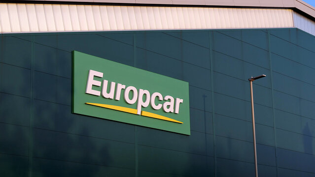 Leicester, England, UK - 19 July 2026: Europcar, car rental, company logo, sign on modern building green facade, rental office UK
