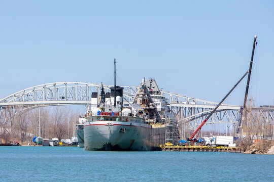 Crane loading Cargo Container export container ship at terminal logistics lake port freight shipping by ship