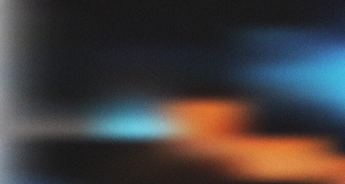 Mysterious dark gradient featuring a captivating interplay of blue light and warm orange tones with grain