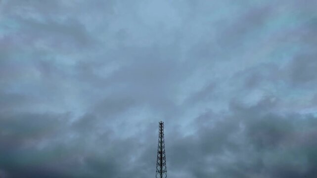 Dramatic Time-lapse of Telecommunication Tower under a Dark Cloudy Sky