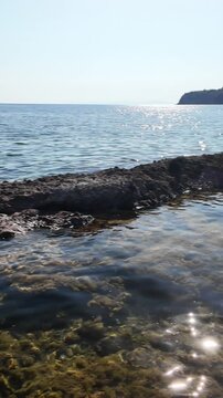 Rocky coastline and crystal clear waters on the Aegean Sea on the island of Thasos, Greece