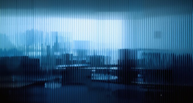 View through ribbed glass surface distorting indoor office or study room, blue color palette blending with silhouettes and ambient light gradients
