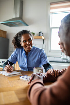 Nurse supporting senior during home care visit