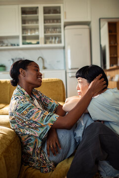 female couple sharing a comforting moment at home
