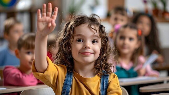 Happy School Girl Raising Hand in Classroom Active Learning and Elementary Education Concept