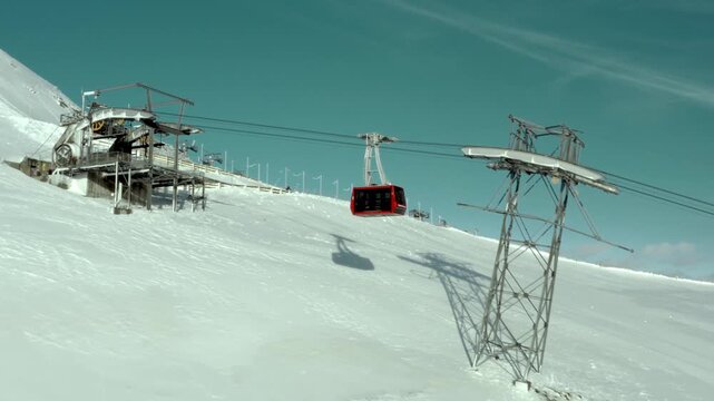 Ski resort aerial tramway in snowy mountain landscape