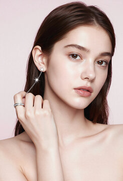 Beautiful young Asian woman wearing silver star chain earring