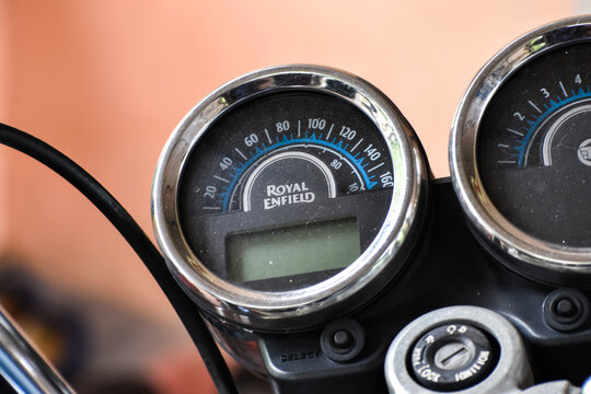 KERALA, INDIA - JULY 20, 2020: Close up of a Royal Enfield Thunderbird 350 motorcycle instrument cluster and speedometer gauge.