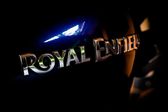 20/07/2020- Kerala, India: Marine blue Royal Enfield Thunderbird 350 motorcycle logo closeup in Kerala, India. Selective Focus applied.