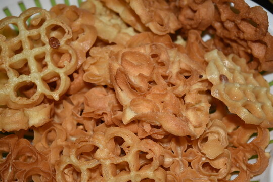 Close up of traditional Kerala achappam rose cookies snack prepared for Onam celebration with selective focus.