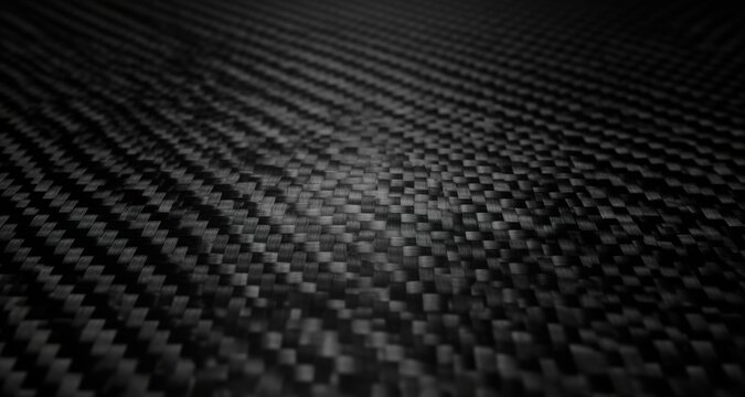  Close-up of woven black carbon fiber texture with subtle reflections. Great for backgrounds, textures and automotive pro
