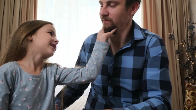 Father and daughter share hug, love defining gentle home interaction. Love brings comfort and reassurance, while love communicates affection, emotional safety, and modern family wellbeing.