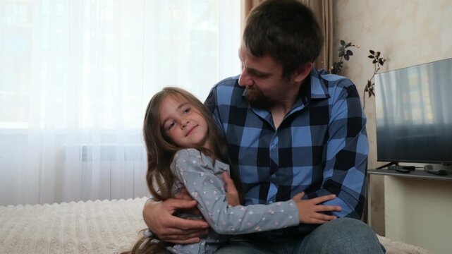 Father and daughter share hug, love defining gentle home interaction. Love brings comfort and reassurance, while love communicates affection, emotional safety, and modern family wellbeing.