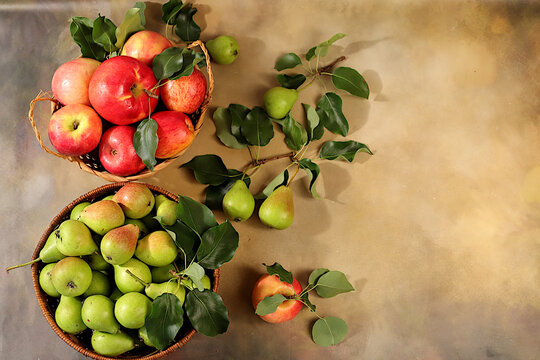 Apples and pears in baskets on a sunlit concrete table, Thanksgiving background, rustic harvest, healthy natural food concept, detox diet and body cleansing, banner for screen, business card for cafe