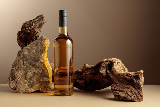 White wine with old driftwood and a piece of granite rock.