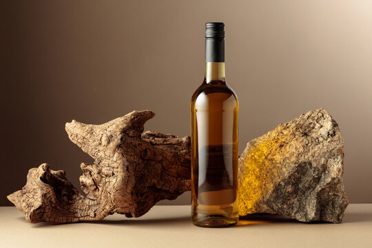 White wine with old driftwood and a piece of granite rock.