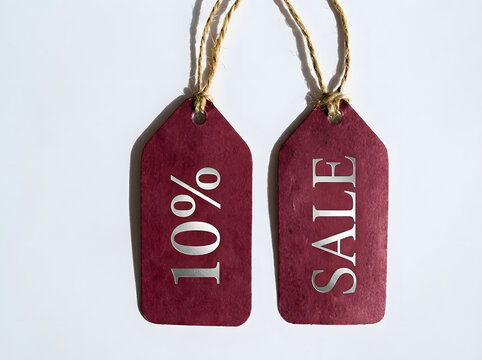 Ten Percent Sale Discount Hanging Price Tags With Burgundy Paper Labels And Rustic Twine Retail Promotion Concept