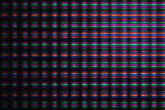 Macro close up view of computer screen subpixel grid showing red green and blue light emitting diodes 