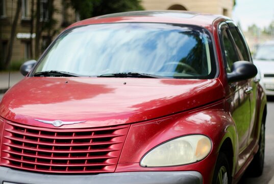 August 5, 2016, Saint Petersburg, Russia, red Chrysler PT Cruiser on the city street, a beautiful, vibrant photo