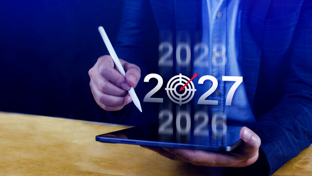 Vision 2027. Business Target for 2027, Businessman Pointing at Year 2027 with Dartboard Target Icon, Financial Goals and Business Strategy, Planning and Investment, not ai