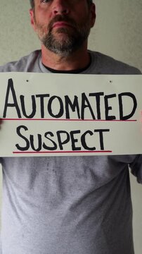 Man attaching protest license plates to vehicle using screwdriver, illustrating citizen pushback against ALPR surveillance - Fourth Amendment privacy