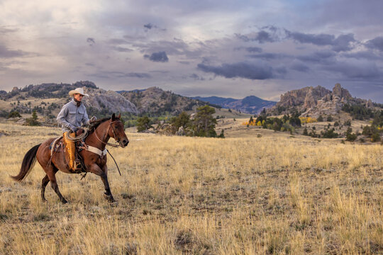 Wyoming Cowboy Horse Ranch scenic loping saddled