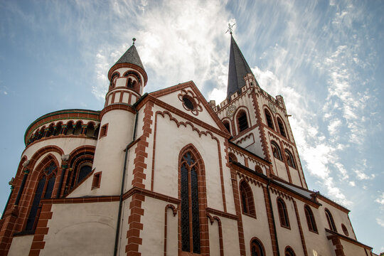 Architectural low angle detail of the distinct white and red facade of Saint Peter's Church in Bacharach Germany