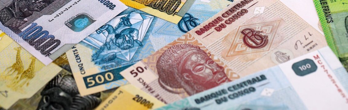 CFA franc money bills pile on table. Republic of the Congo banknotes of XAF currency close up.