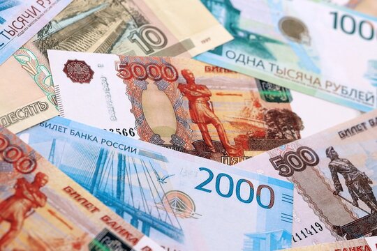Russian ruble money bills pile on table. Russia banknotes of RUB currency close up.