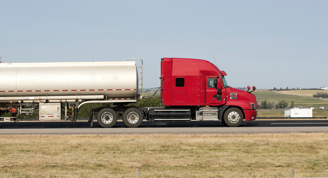 Heavy Cargo on the Road. A truck hauling freight along a highway. Taken near Airdrie, Alberta, Canada