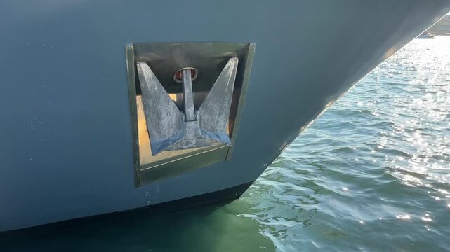 Close up of a ship anchor stowed in the hull of a vessel on the water