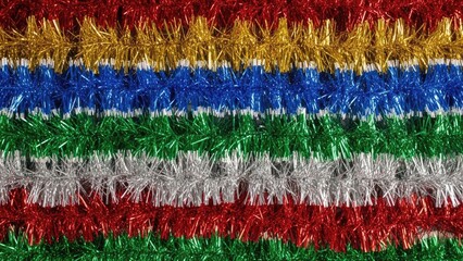 Obraz premium Colorful Christmas tinsel garlands in red, gold, blue, green, and silver stripes for festive holiday decoration