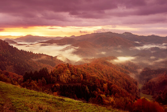 Misty autumn mountain landscape at sunrise in Slovenia
