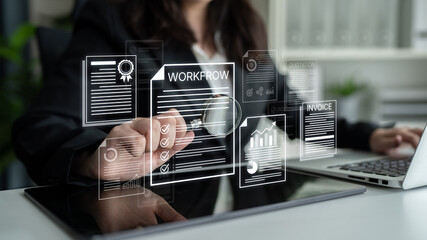 Obraz premium Professional Businesswoman Analyzing Workflow and Invoice Documents with Magnifying Glass in Modern Office Environment. Bitwise.