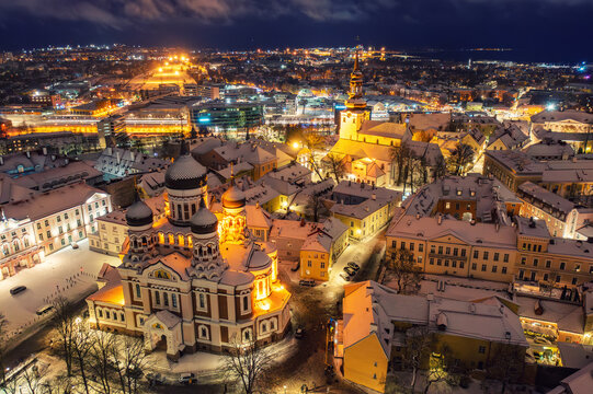 Aerial night View of Tallinn in winter with Alexander Nevsky Cathedral, roofs with snow, Christmas mood