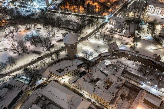 Aerial night View of Tallinn in winter, roofs are covered with snow, Christmas mood