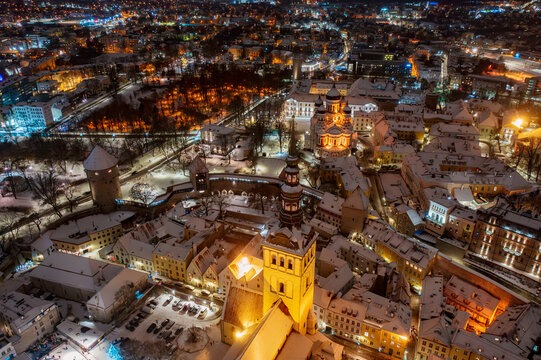 Aerial night View of Tallinn in winter with Alexander Nevsky Cathedral, roofs with snow, Christmas mood