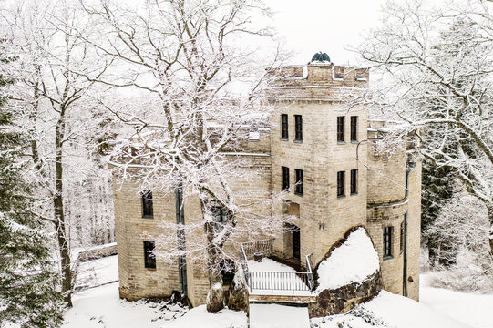 Old castle in the winter Glen park. Tallinn, Estonia.