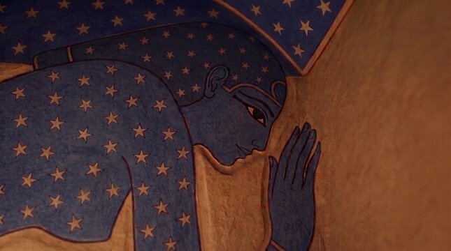 Ancient Egyptian painted relief of the blue sky goddess Nut arched with five-pointed stars