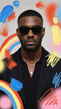 Stylish man in sunglasses with abstract paint stroke backdrop