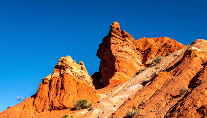 Fototapeta premium Scenic red sandstone rock formations in skazka canyon under clear blue sky, copy space